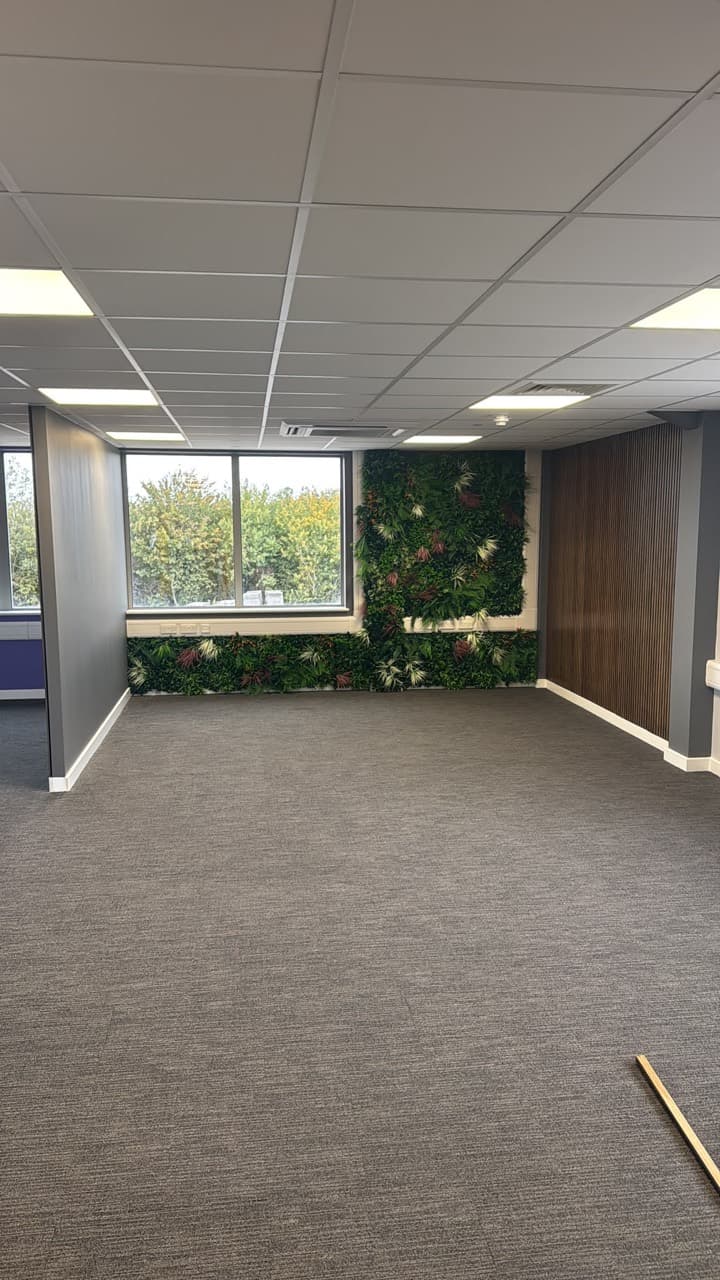 Arcadia office area framed by a decorated partition and feature panels