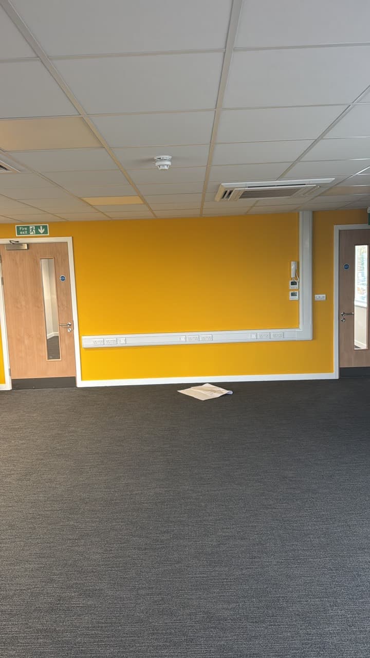 Yellow feature wall and neat white trim at Arcadia