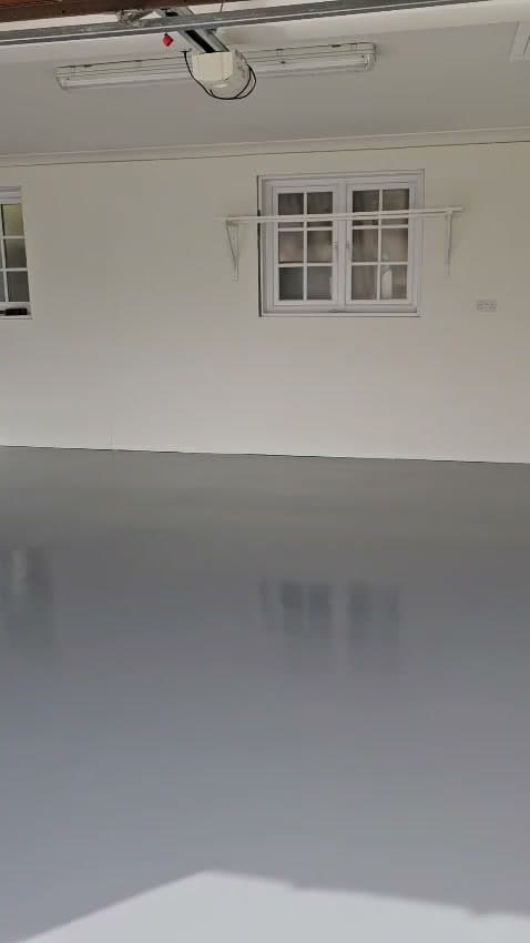 Seamless resin garage floor finished in mid grey