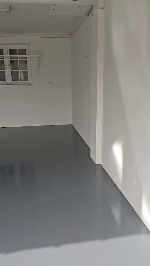 Walkthrough of a finished garage refurbishment with a grey resin floor and freshly painted walls