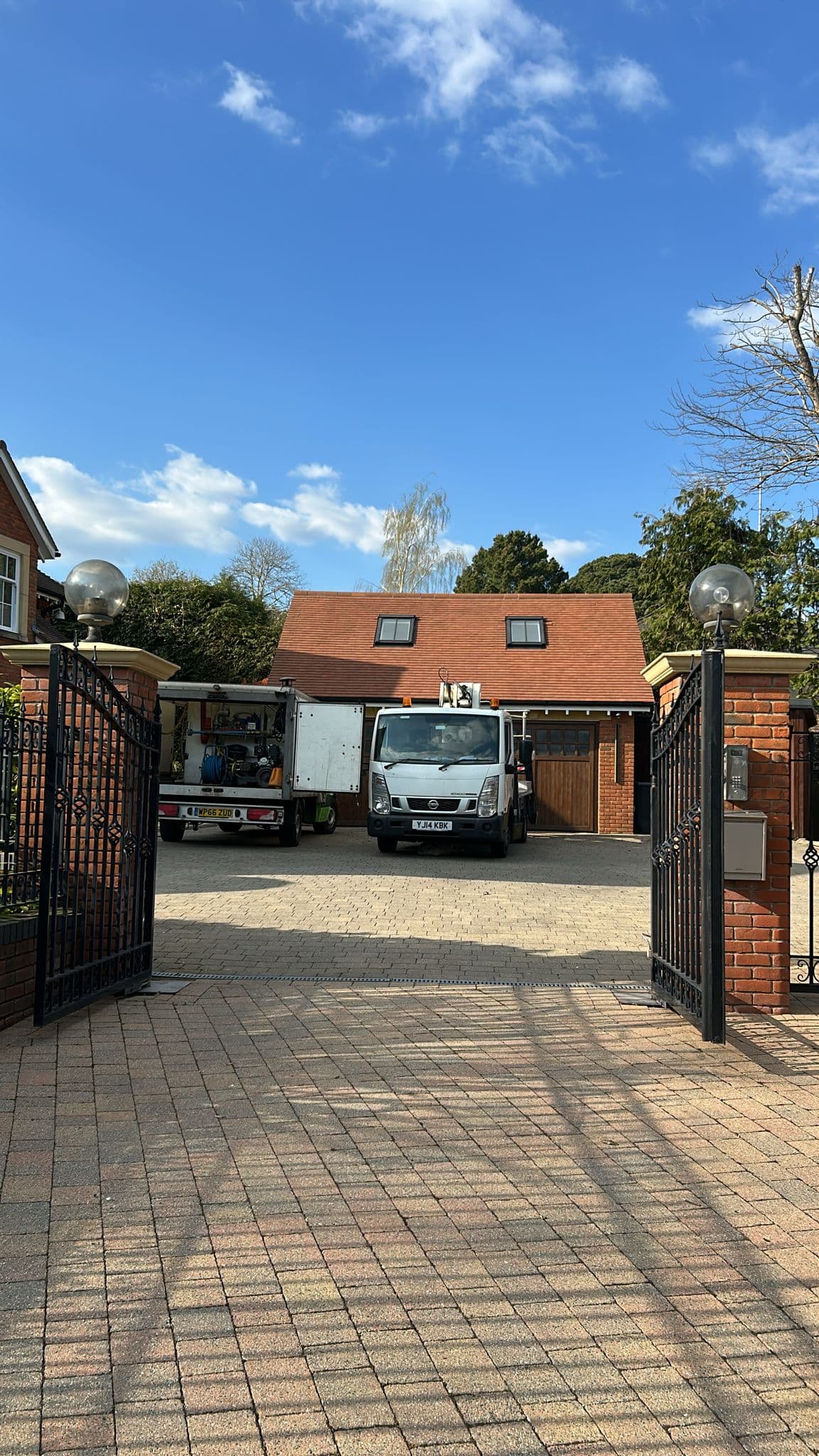 Powered access platform on a private property for roof soft washing